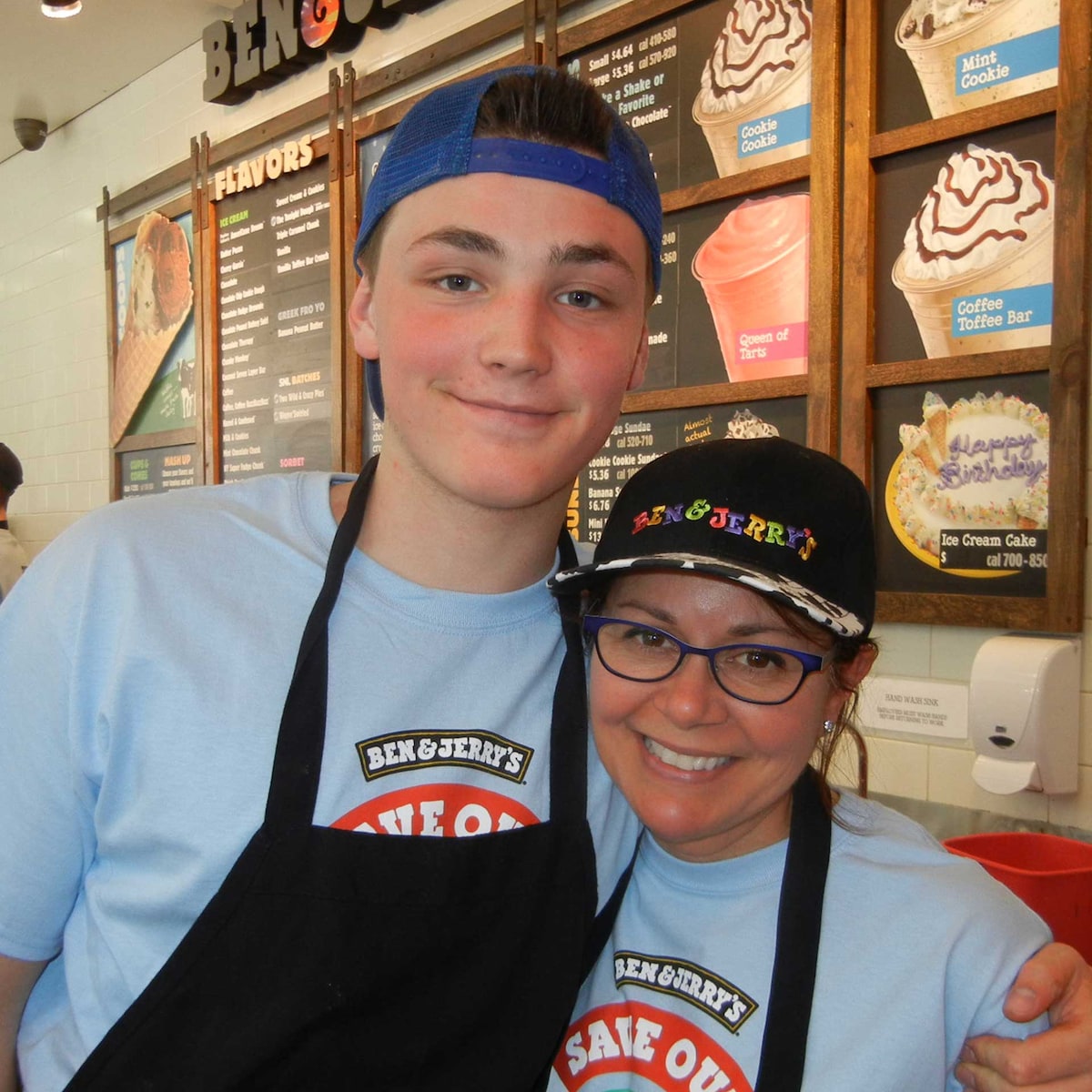 Two scoop shop scoopers hugging