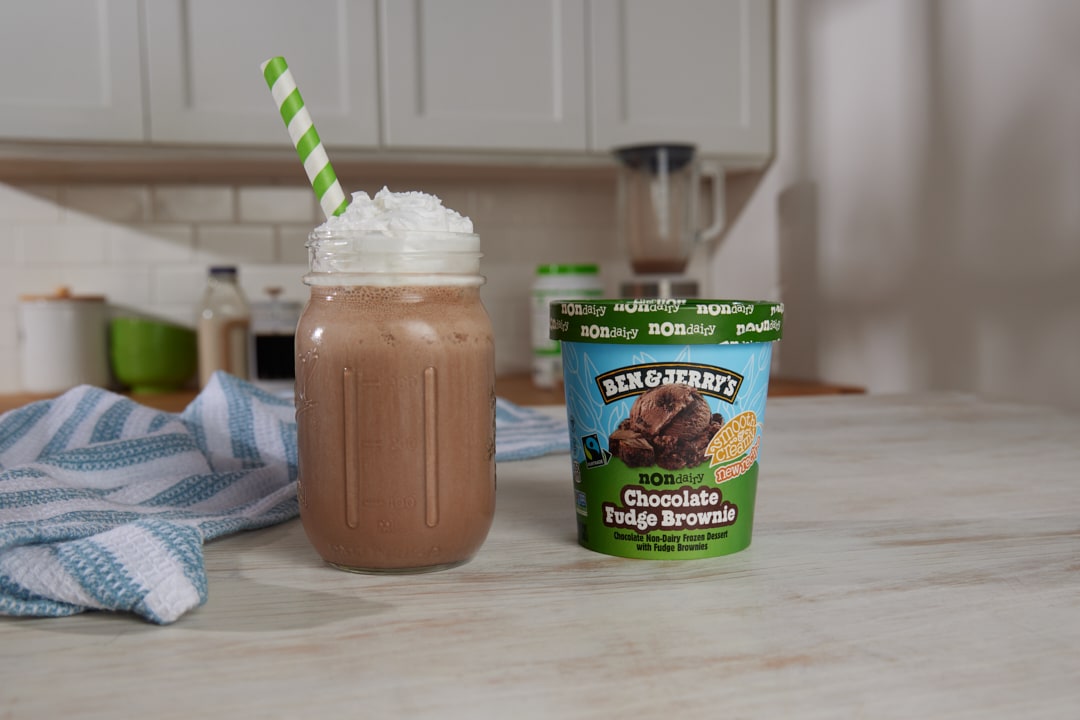 Ben & Jerry's New-Year-New-You Coffee Shake next to a pint of Ben & Jerry's Chocolate Fudge Brownie Non-Dairy.