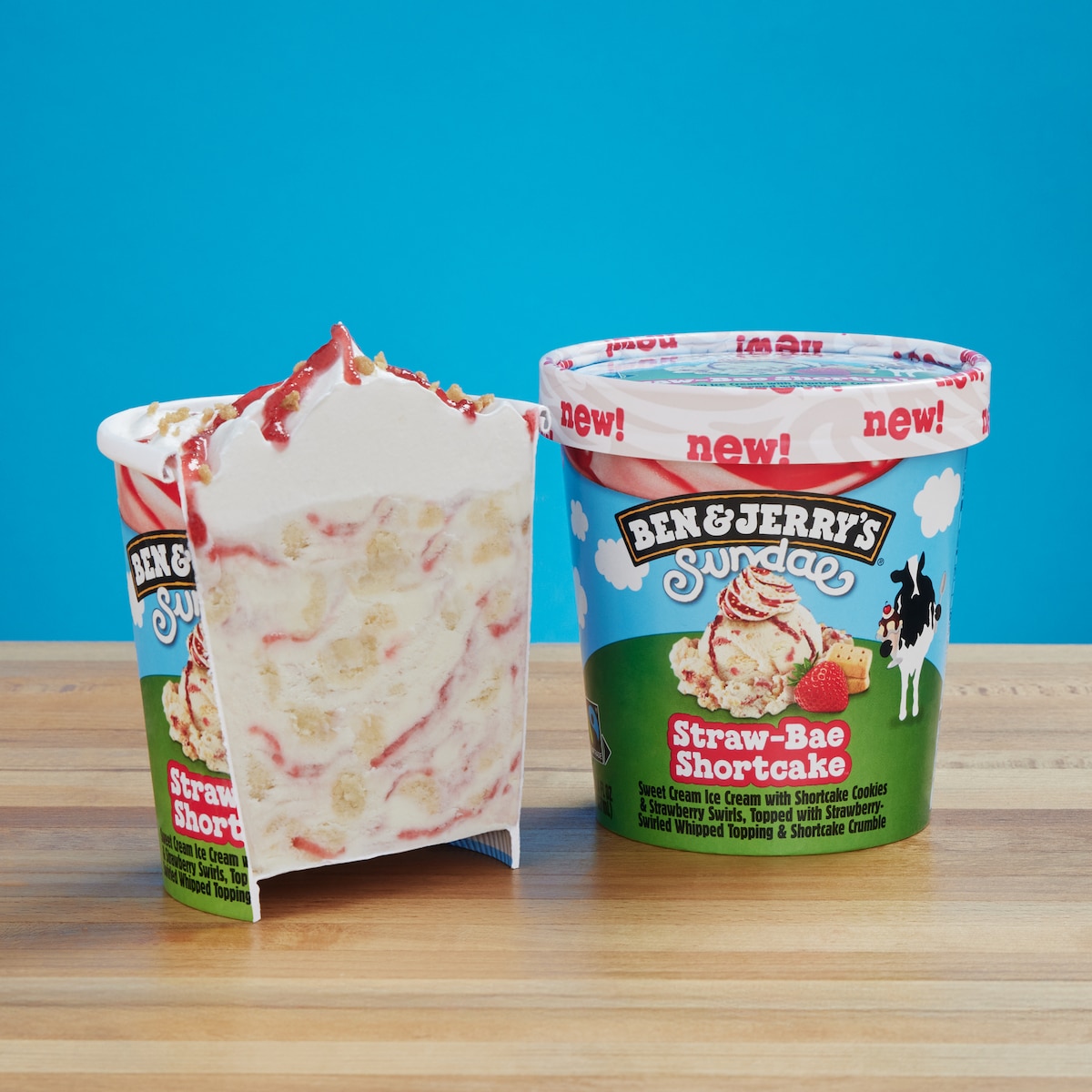 Pint of Ben & Jerry's Straw-Bae Shortcake Sundae ice cream cut in half so you can see the whipped topping.