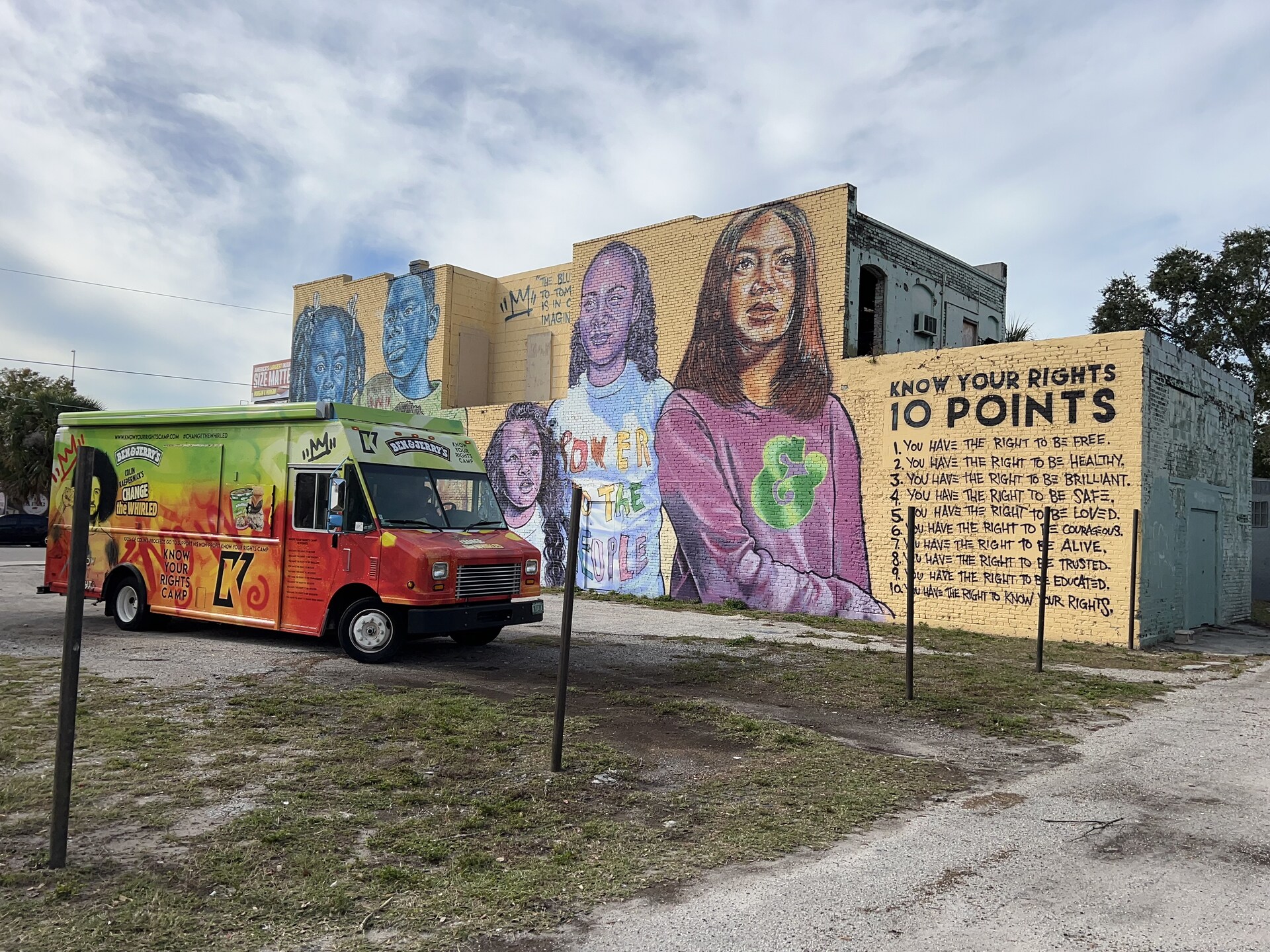 Ben & Jerry's scoop truck next to a Know Your Rights Camp mural in Tampa, FL