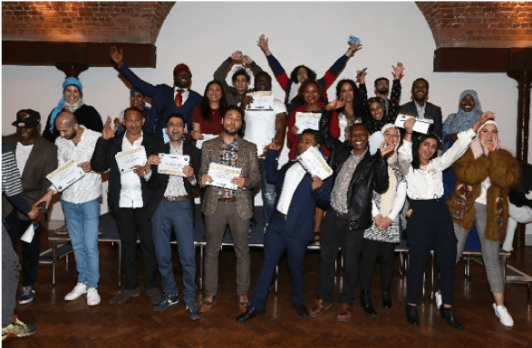 Group of people at the ice-academy celebrating