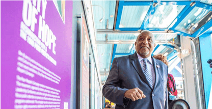 Dr. Lafayette walking down a hall way