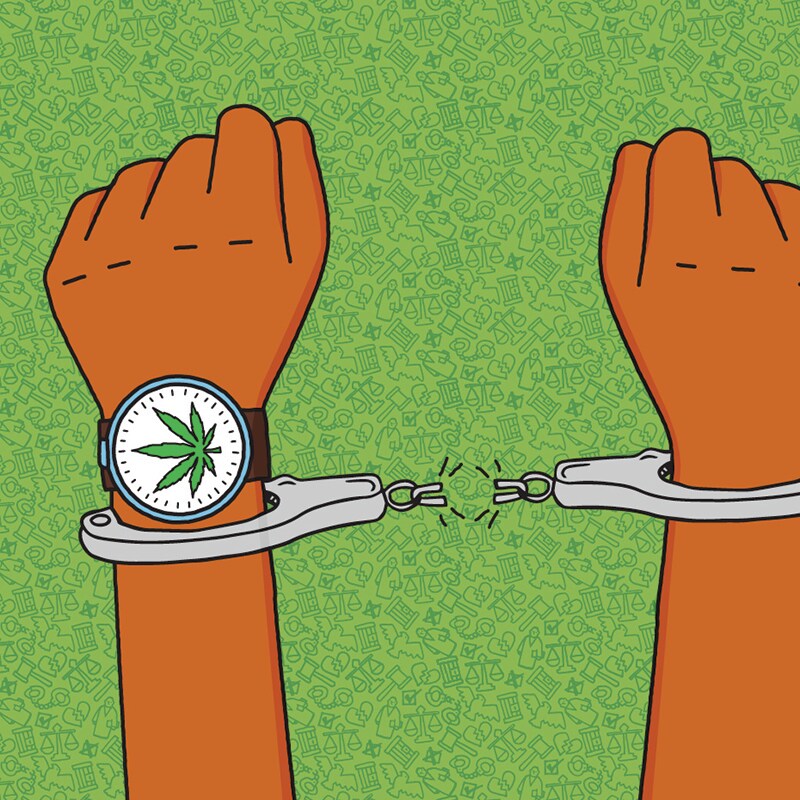 Hand holding a gavel with a cannabis leaf watch