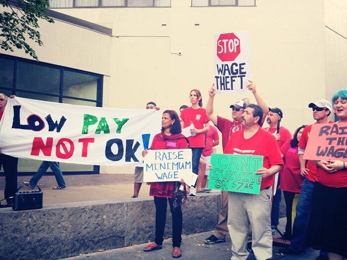People holding signs