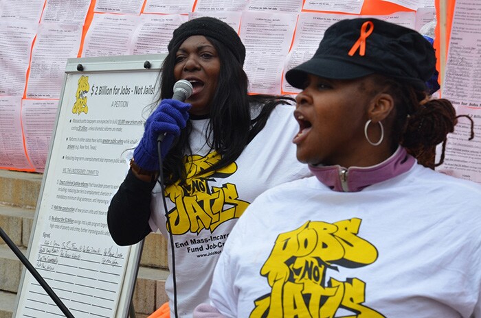 woman speaking into microphone