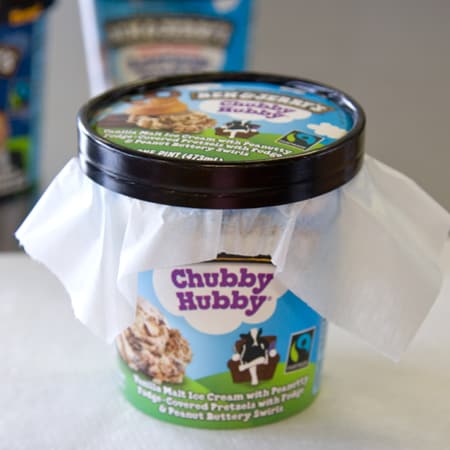 Prevent freezer burn of your Ben & Jerry's by wrapping it with wax paper after use.