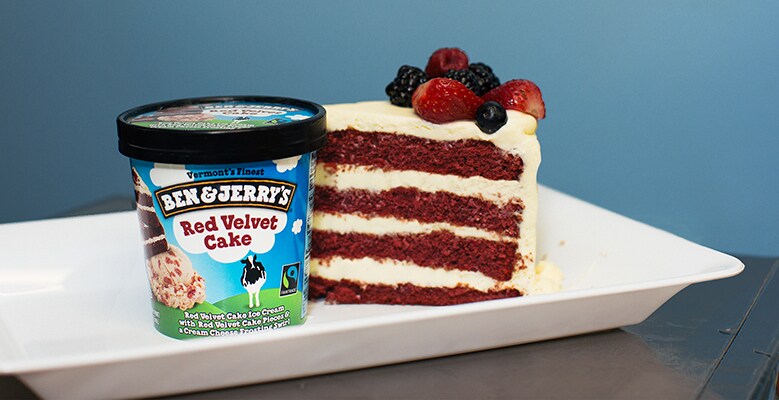 A pint of Red Velvet Cake Ben & Jerry's ice cream with a piece of red velvet cake