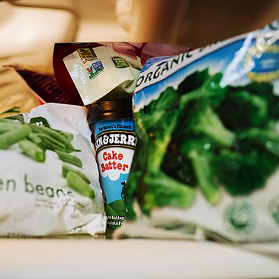 Freezer with pint of Ben & Jerry's ice cream hidden way in the back.