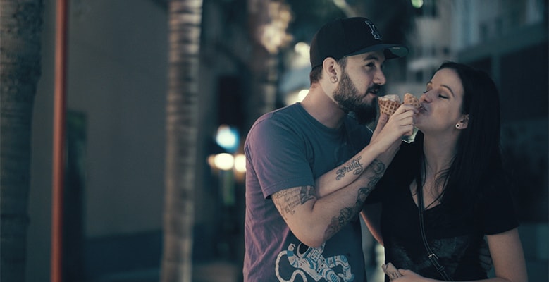 Man and woman eating cones