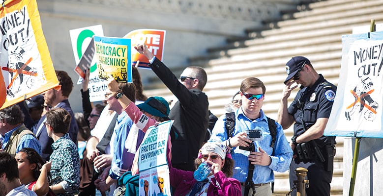 Protesters with signs at Capital Hill