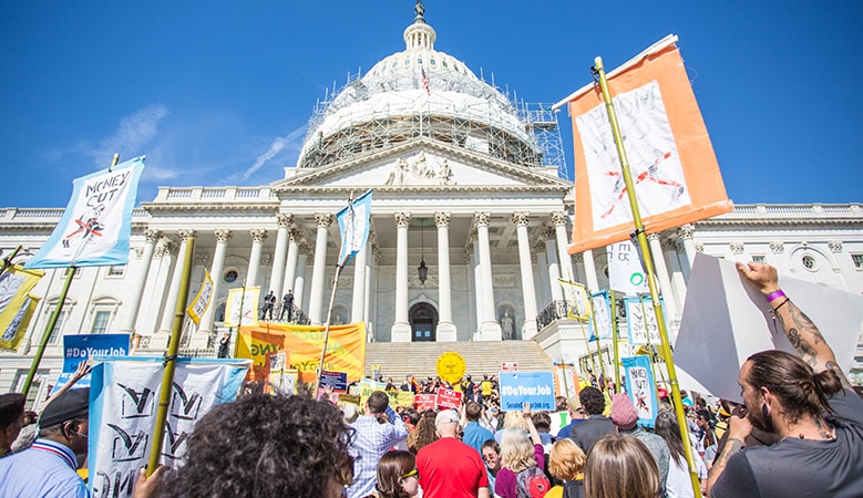 Protesters with signs at Capital Hill