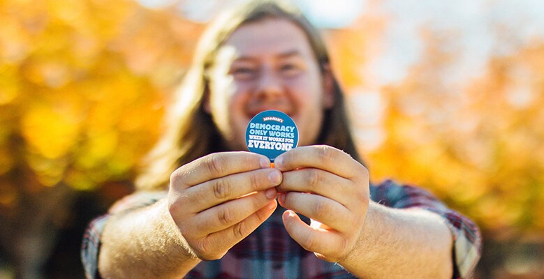 Man with sticker, Ben & Jerry's democracy campaign