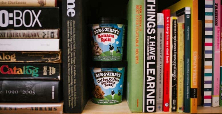 bookcase with two pints of ice cream between books