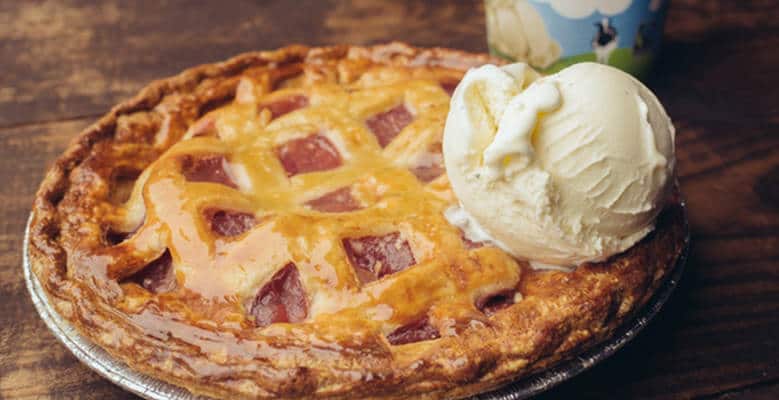 A whole pie with scoop of ice cream