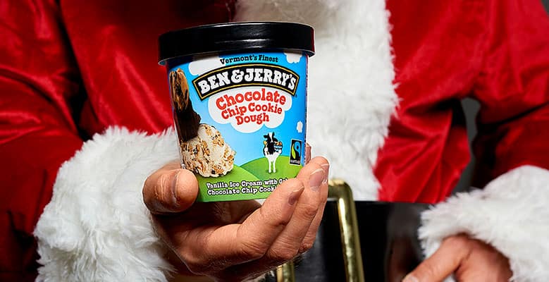 Santa holding a pint of Chocolate Chip Cookie Dough