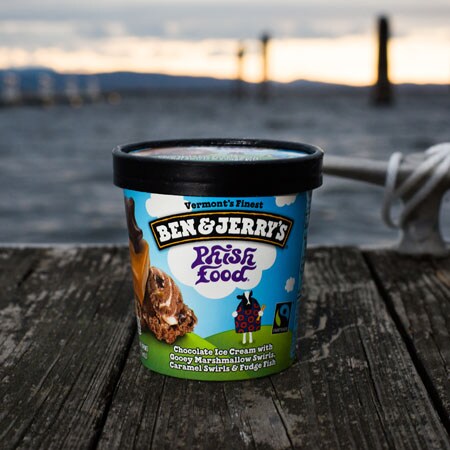 A Pint of Ben & Jerry's Phish Food sitting on a dock