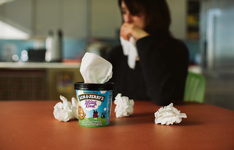 A pint of Phish Food with kleenex and a women crying