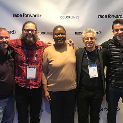 Five people from the Ben & Jerry's team stand together at the Facing Race conference, November 2018