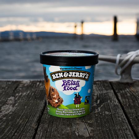 A pint of Ben & Jerry's Phish Food Ice cream sitting on a dock